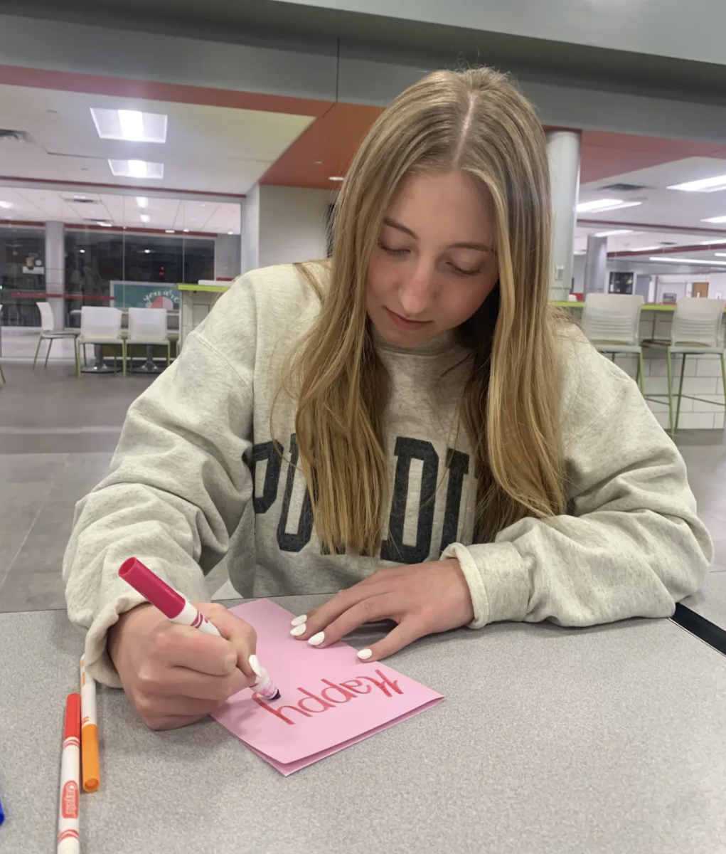 Paying attention to detail, senior Kiersten Meisberger makes a valentine for a local nursing home at this week’s HOSA meeting. On Valentine’s day, HOSA students will go to Aspen Trace to give out the valentines and have fun with the residents. “Today during our monthly HOSA meeting, we made Valentine’s Day cards for residents of Aspen Trace,” Meisberger said. “It’s important to our club that we make everyone in our community feel loved and remembered on this special holiday.”